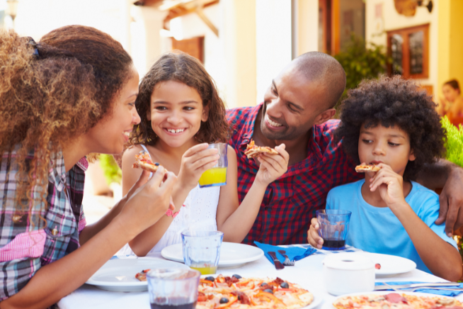 Family enjoying a meal out