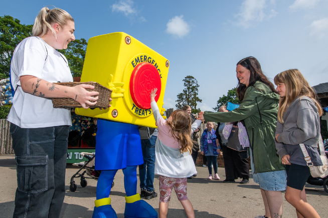Members enjoying a Blue Light Card Member Day with the Blue Light Card mascot